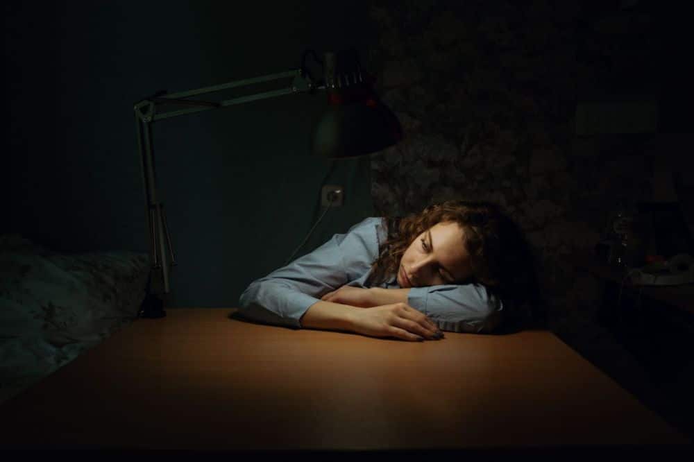 Fibromyalgia patient resting at home experiencing widespread chronic pain symptoms