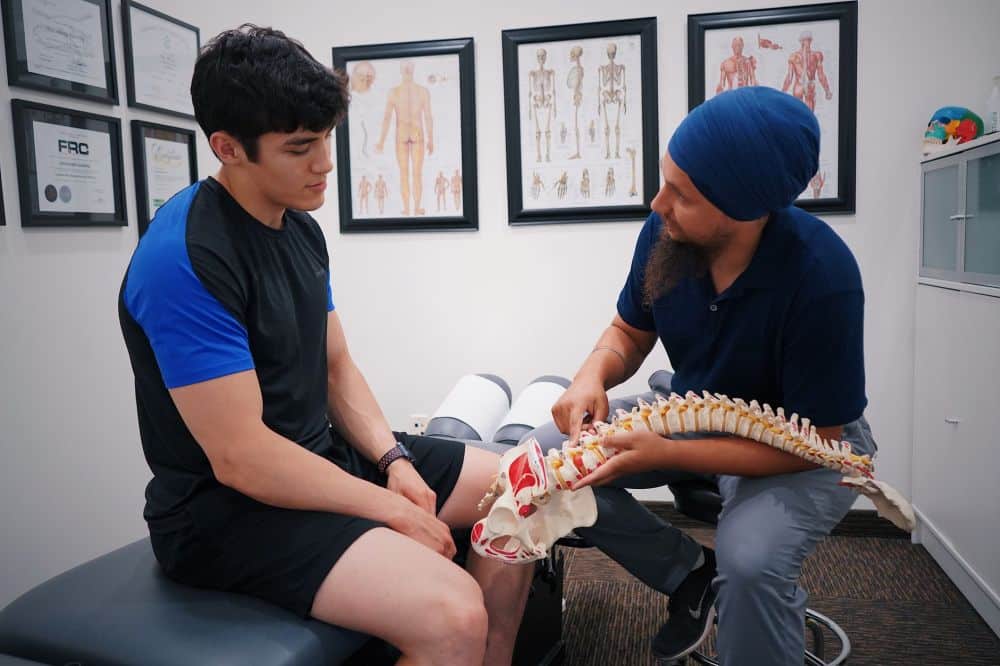 Patient discussing chronic migraine symptoms with pain management doctor in Texas clinic