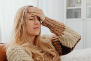 Woman experiencing chronic migraine relief through interventional pain treatment in Grand Prairie TX