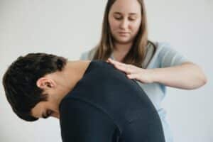 Pain specialist consulting patient about chronic migraine treatment options in Plano TX