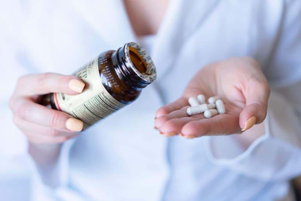Melatonin sleep supplement on bedside table linked to chronic pain research