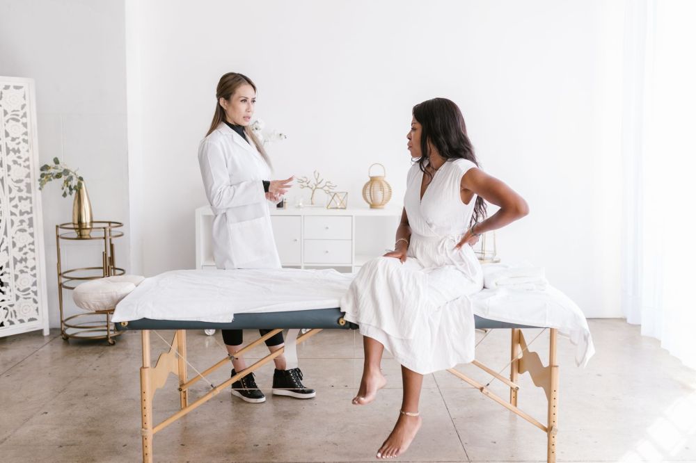 Fibromyalgia & Chronic Pain Management in Plano, TX 1 Interventional pain management doctor discussing fibromyalgia treatment plan with patient
