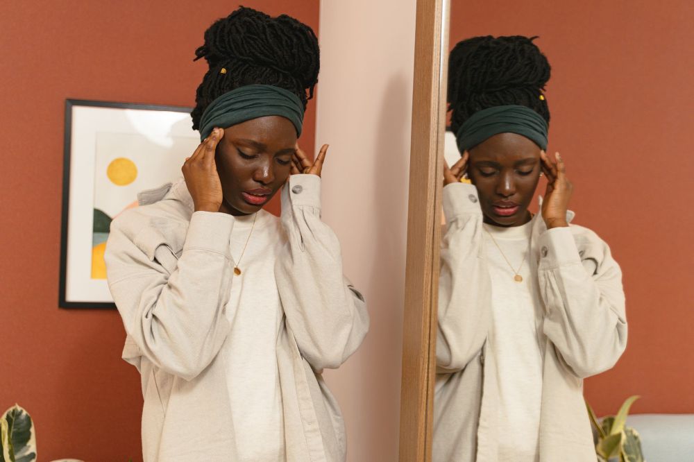 AI Discovers New Non-Opioid Pain Drug | Plano, TX 1 Woman holding her temples experiencing chronic migraine headache pain