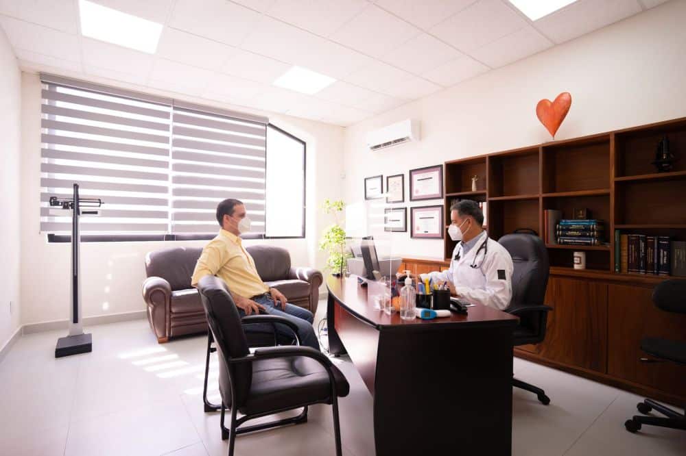 Pain management doctor consulting with a patient in a clinical office setting