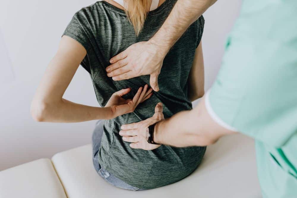 Patient discussing non-opioid pain treatment options with a specialist at Grand Prairie clinic