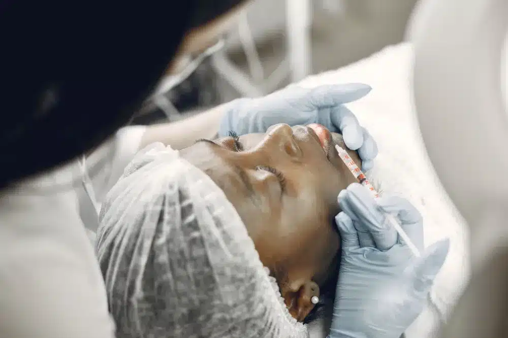 Botox for Chronic Migraines in Grand Prairie, TX | Same-Week Consults 2 Clinician administering targeted injection to neck area for migraine pain management