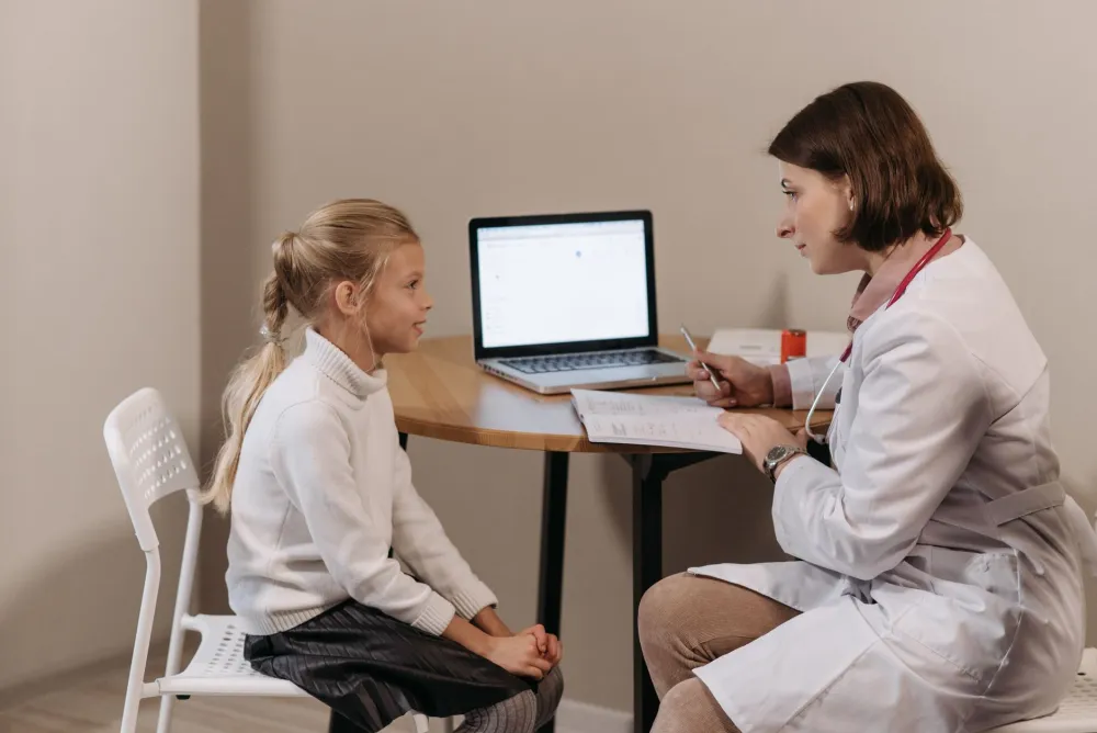 Interventional pain specialist consulting with a chronic migraine patient at a Plano Texas clinic