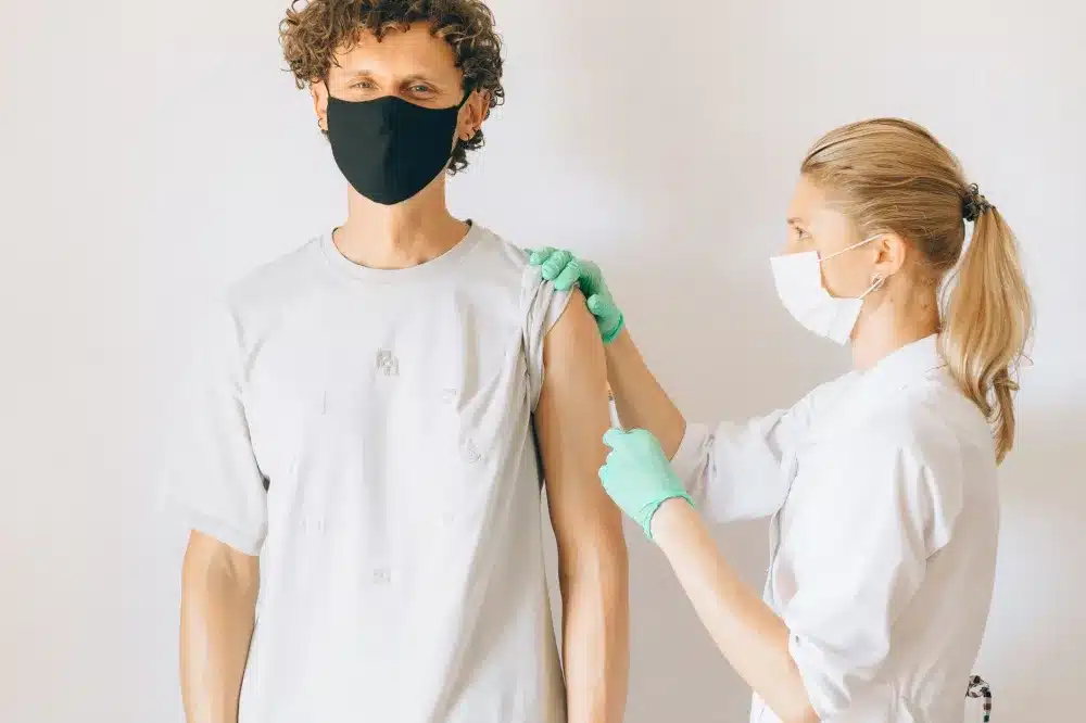 Medical professional administering a therapeutic neck injection for chronic head pain relief