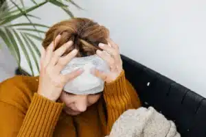 Pain specialist preparing Botox injection for chronic migraine treatment in Plano TX clinic