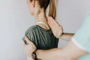 Pain specialist reviewing spine imaging with a patient for facet joint injection in Tyler TX