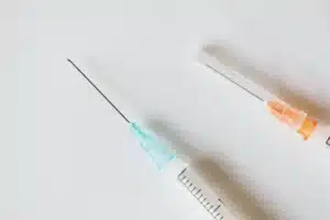 Physician performing lumbar epidural steroid injection for herniated disc pain in Longview TX clinic