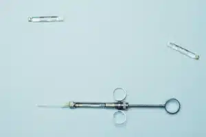 Interventional pain specialist performing a medial branch block injection for facet joint back pain