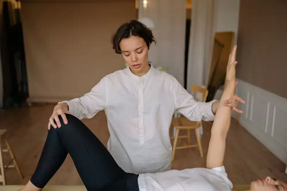 Patient completing therapeutic exercises as part of a multimodal pain management program near Plano TX