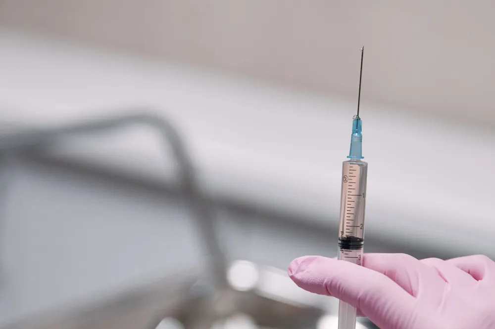 Interventional pain specialist preparing an occipital nerve block injection in a clinic