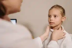 Patient receiving occipital nerve block consultation at a Plano TX pain clinic