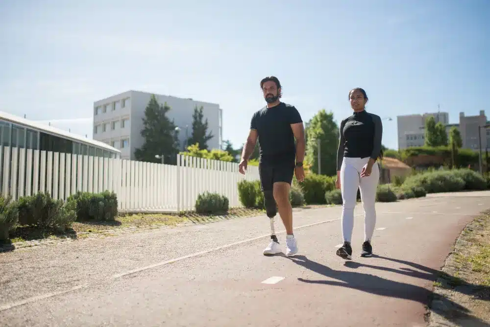 Recovering back pain patient walking outdoors near a Texas medical clinic