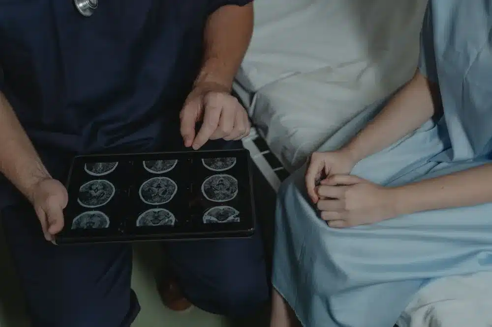Interventional pain specialist reviewing lumbar MRI scans to plan a radiofrequency ablation treatment