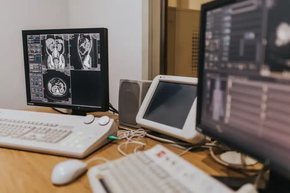 Radiofrequency Ablation in Plano, TX | Non-Surgical Relief 4 Interventional pain management doctor reviewing spinal MRI images with a patient