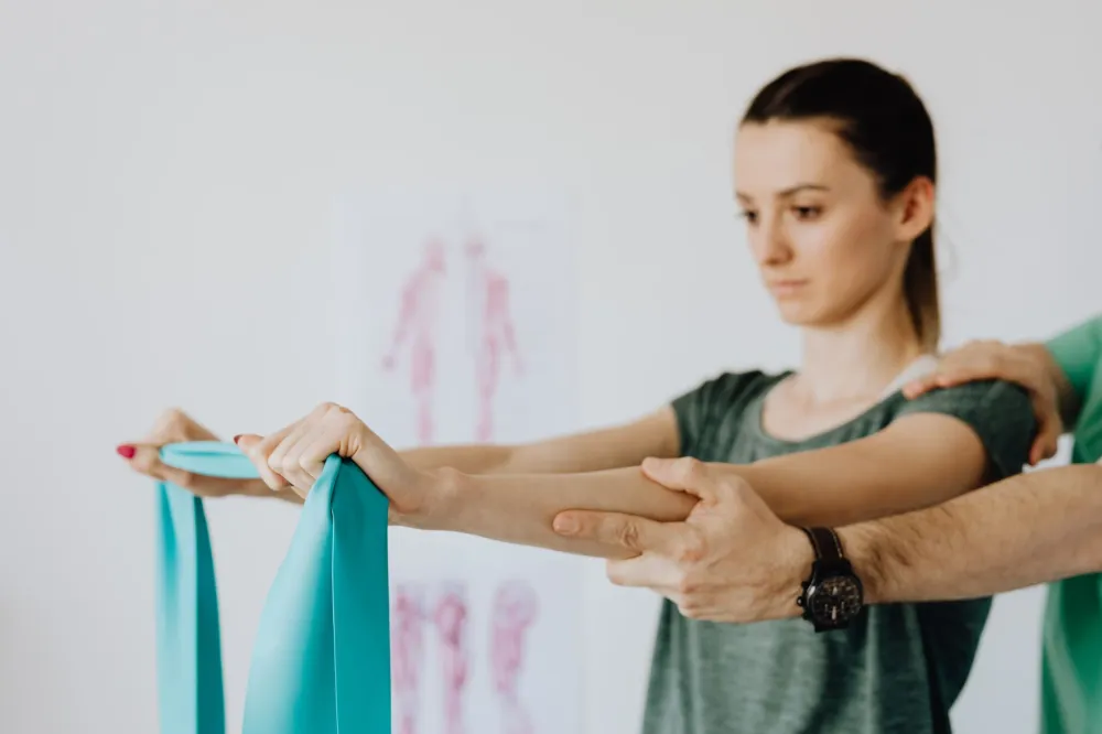 Physical therapist guiding patient through therapeutic stretching exercises for muscle pain relief