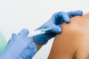 Interventional pain specialist preparing a trigger point injection for myofascial pain in Plano TX